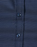 A navy blue button-up shirt with a pin dot pattern and blue buttons. Features a textured fabric design.