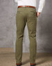 Men's chinos in olive green, featuring a slim fit and back pockets, paired with a brown belt.