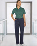 Ladies' utility cargo pants in navy, paired with a green polo shirt, displayed in a modern indoor setting.