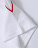 A white polo shirt featuring red accents on the sleeves and a logo.