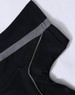 A black polo shirt with grey detailing on the collar and sleeves, featuring a logo.
