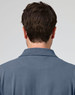 A men's cotton stretch polo shirt in a blue shade, featuring a collar and logo on the back.