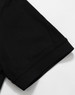 A black Men's Truedry Pique Polo shirt showcasing the sleeve detail. The shirt features a logo.