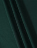 A close-up image of dark green fabric with soft texture, showcasing folds and draping.