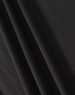 A close-up of black fabric showcasing texture and drape, featuring a subtle weave pattern.