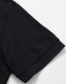 A black polo shirt with a solid design, featuring short sleeves and a classic collar. Includes a logo.