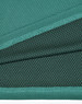 A fabric close-up of a teal bamboo charcoal polo shirt, featuring textured and dotted patterns.