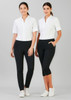 Two women are wearing women's 3/4 length stretch pants in black, paired with white shirts. The pants feature pockets.