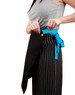 A woman adjusts a black canvas short waist apron with a blue tie, featuring a button and logo.