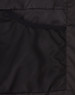 A black parka jacket featuring a textured inner pocket and smooth exterior materials. Includes a logo.