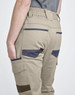 Unisex cotton stretch drill cuffed work pants in beige with navy accents and pockets, featuring an elastic waistband.