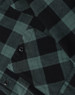 A close-up of a unisex flannel plaid shirt featuring a black and dark green check pattern with button details.