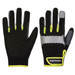 A pair of black gloves with grey and neon yellow accents, featuring a logo on the wrist area.