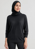 A black women's batwing sweater top, featuring a relaxed fit and long sleeves, worn with a matching headscarf.