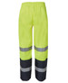 Premium rain pants in bright yellow with reflective grey stripes, featuring an elastic waistband and black lower sections.