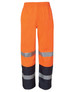 Premium rain pants in bright orange with reflective silver stripes and navy accents. Elastic waistband for comfort.