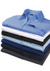 A stack of button-up shirts in various colours including blue, black, and white. Each shirt features a collar and buttons.