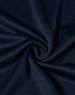 A close-up of navy blue textured fabric, displaying a smooth, lightweight weave. The fabric has a logo present.
