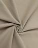 A close-up of beige premium cotton fabric, showcasing a smooth texture and soft, folded appearance.