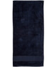 A dark navy terry velour beach towel measuring 75x150 cm, featuring a simple design and a branded logo.