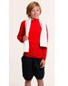 A young boy in a red long-sleeve top and black shorts holds a white terry velour fitness towel.