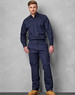 Navy blue men's cotton drill cargo pants featuring knee pads, with a fitted design and button-up shirt.