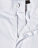 A close-up view of white unisex utility stretch cargo work pants showcasing the waistband and button detail.