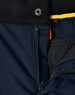A close-up of navy Rip-Stop Poly/Cotton Stretch Work Pants, showcasing the zipper and fabric texture. Features a logo.