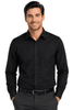 A long sleeve button-up shirt in black, featuring a pocket and a branded logo.