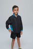 A child wearing a black tracktop with blue accents, paired with black shorts, stands confidently.