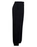 Black fleecy track pants featuring zip cuffs and knee padding, designed for kids, with an elastic waistband.