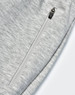 A pair of light grey poly/cotton terry sweat pants featuring a zip pocket.
