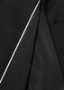 A close-up of the inside lining of a black jacket featuring a contrasting white trim and a sleek design.