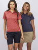 Two women wearing polo shirts in red and navy, standing side by side against a plain background.