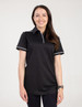 A black polo shirt featuring a collar and contrasting piping, displayed on a smiling woman. The shirt has a logo.