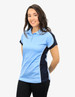 A polo shirt in light blue with navy accents, featuring a logo. It's worn by a woman standing against a plain background.