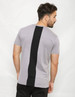 A grey T-shirt featuring a black panel along the back. The shirt has a fitted style.