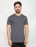 A grey short-sleeved T-shirt featuring a back panel design. The model stands against a neutral background.