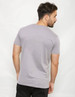 A plain two-toned grey t-shirt from the back, featuring a fitted silhouette and a discreet logo.
