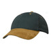 A cap featuring a dark green cotton body and a tan suede peak, with a logo on the front.