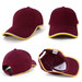 A burgundy cap with a yellow trim and a small logo, featuring a classic baseball style design.