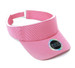 A pink visor with a removable sweat band and an emblem, featuring a textured design and adjustable strap.