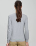 A long-sleeved, grey women's t-shirt made of premium cotton with a logo on the back.