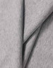 A close-up of light grey cotton fabric, showcasing its soft texture and smooth finish. The fabric has a logo.