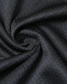 A close-up of black jacquard knit fabric, featuring a textured pattern and a subtle sheen, ideal for polo shirts.