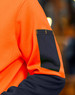 A Hi-Vis two-tone water-resistant fleece hoodie in bright orange and black, featuring a contrast pocket on the sleeve.