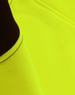 A close-up of a bright yellow fleece fabric with dark brown accents, featuring a logo.