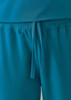 Teal women's jogger scrub pants featuring an elastic waistband and tie detail. The fabric appears soft and comfortable.