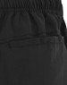 Black unisex mercerised cotton shorts featuring an elastic waistband and a side pocket. Includes branding on the fabric.