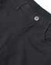 Black men's chino pants featuring a flexible waistband and button closure, with detailed stitching and pockets.